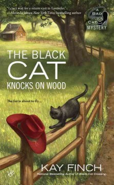 The black cat knocks on wood  Cover Image