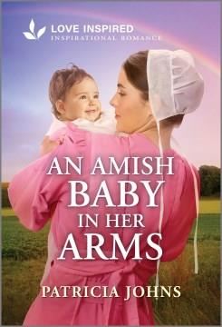 An Amish baby in her arms  Cover Image